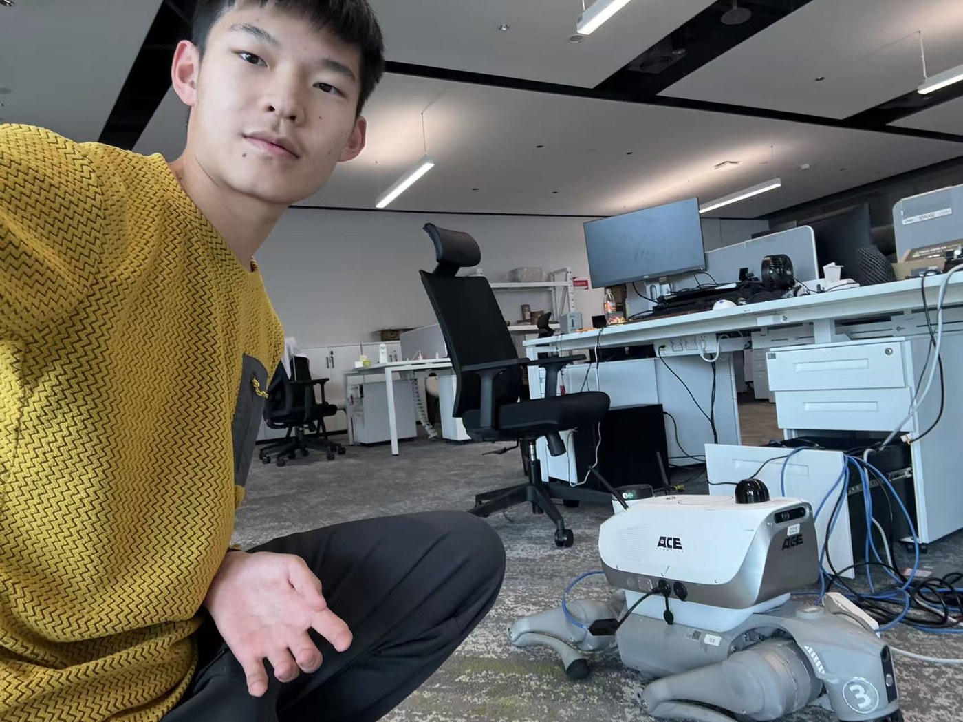 Winson with the navigation robot at ACE Robotics